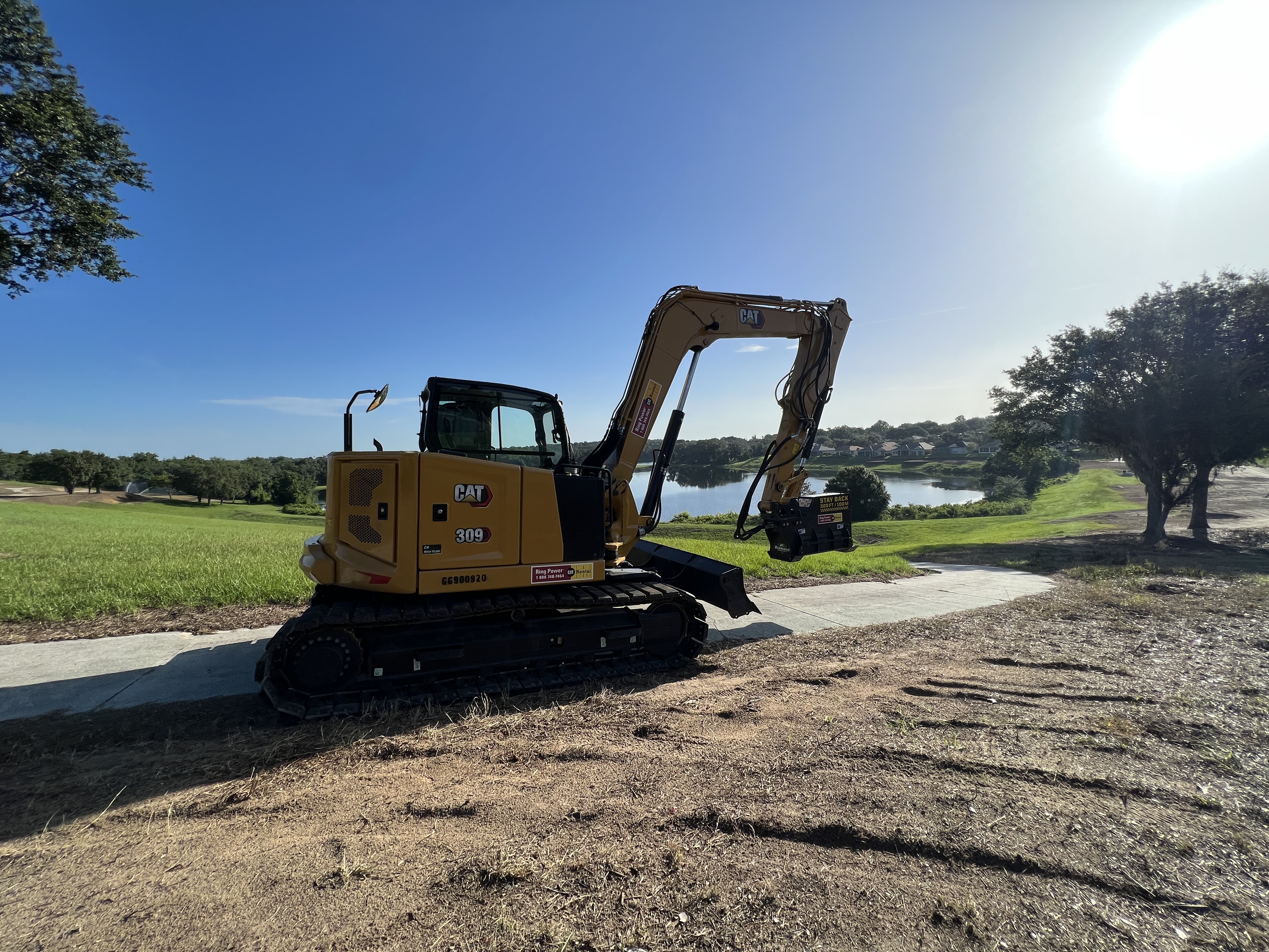 CAT 309 excavator with Diamond Mowers attachment land clearing Florida
